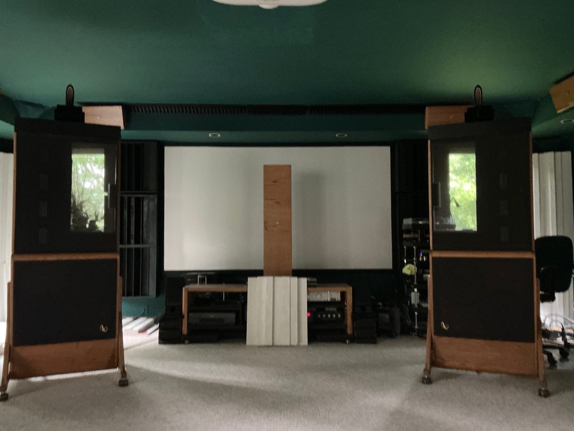 Home theater listening room — MADO open-baffle speakers with projection screen, green ceiling